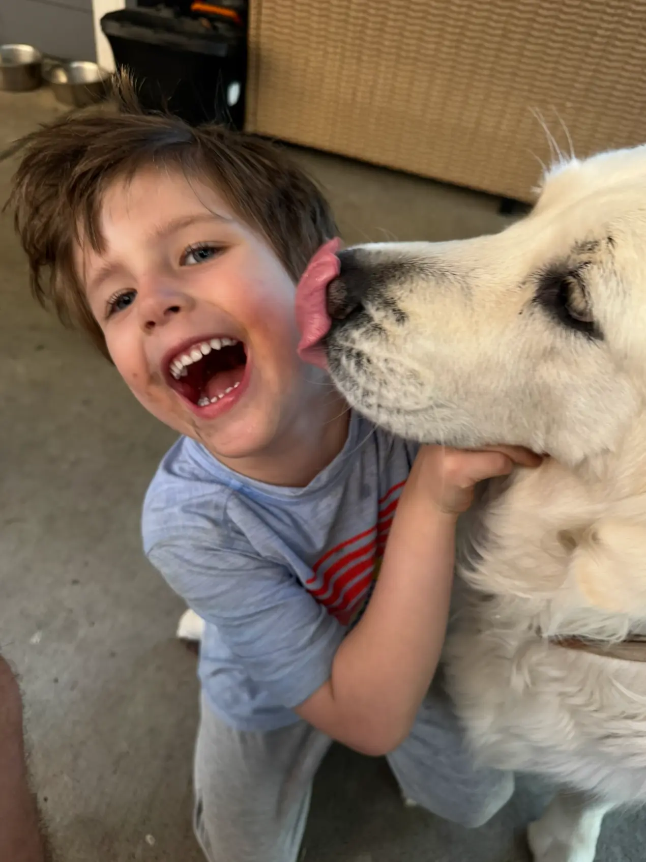 Luca laughing with his dog